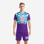 Custom purple and teal crystal soccer kit front view with team name and number sublimated on jersey