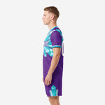 Side view right of custom purple soccer kit with teal crystal accents on jersey and shorts hem