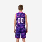 Opposite side view of purple camo youth basketball jersey and shorts set with pink lightning overlay and elastic drawcord waistband