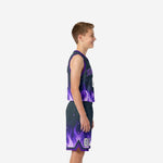 Front view of custom purple youth basketball uniforms with arced team name and front number on charcoal jersey