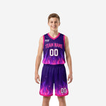 Custom purple youth basketball uniforms with pink flame graphic, team name arced on chest and matching shorts, front and back view