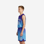 Side view of purple and sky blue youth basketball uniform set showing V-neck jersey and matching shorts with hem trim
