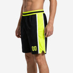 Custom rec league basketball shorts in black with neon yellow side panel, white border stripe, and elastic waistband, front view