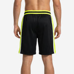 Black and neon yellow custom basketball shorts showing wide side panel and white trim, left side view