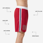 Close detail of white-outlined player number on the lower left thigh of red custom basketball shorts with sublimated print