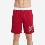 Custom rec league basketball shorts in red with white elastic waistband, navy and white side stripe, and white-outlined player number on the left thigh - front view