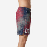 side view of red and navy sublimated rec league basketball shorts showing hem vent split and star graphic on full leg panel