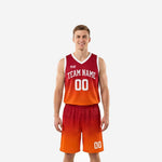 Custom rec league basketball uniforms in red-to-orange gradient with white V-neck trim, team name arc and front number on adult male model, front view