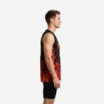 Front view of a custom red and black sleeveless basketball jersey showing the V-neck collar, black upper body, and rising flame graphic across the lower panel