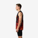 Left side view of the custom red and black basketball jersey showing the flame pattern wrapping around the side panel from front to back