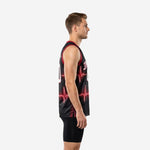 Side view of custom red and black basketball jersey showing red armhole binding, black performance knit fabric, and heartbeat graphic wrapping the side panel