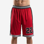 Custom red and black basketball shorts with black side panels, striped waistband, and player number 22 sublimated on the front thigh - front view