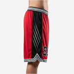 Side view of custom red and black basketball shorts showing wide black side panel with diagonal white slash graphic and V-chevron hem split