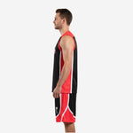 Opposite side view of red and black sublimated basketball uniform set showing panel construction and shorts detail on male model