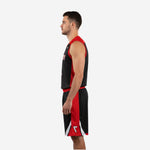 Left side view of sublimated red and black basketball uniform set showing panel construction and shorts waistband detail