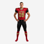 Red and black football uniforms with gold geometric collar trim, team name across chest, and front number 09 in gold on adult male player - front view