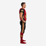 Side view of red and black football uniform showing gold sleeve number, black flame side panel graphic, and black pants with gold and red triple leg stripe