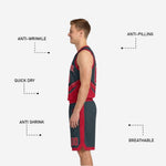 Shorts detail of the red and charcoal reversible basketball uniform showing claw-scratch graphic side panel and player number on the red side