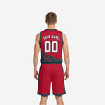 Side view of the red and charcoal reversible basketball jersey showing V-neck binding and armhole binding detail on the red-dominant side