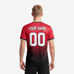 Full-dye sublimated red and black soccer jersey showing edge to edge gradient print quality and breathable mesh polyester fabric
