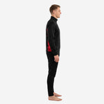 Side view of a red and black soccer tracksuit showing the red splash panel running from the jacket hem down the pant leg