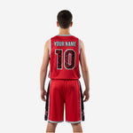 Opposite side view of red and black youth basketball uniforms for youth teams showing matching black panel and silver hem binding on shorts