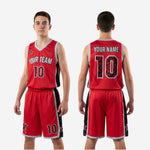 Close detail of red and black youth basketball uniform shorts showing player number star motif graphics and elastic waistband with drawcord