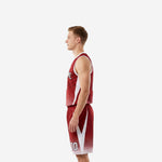 Side view of red and white basketball uniform showing white side panels on jersey and matching shorts with drawcord waistband