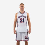 Custom red and white basketball uniforms two-piece set with navy side panels and striped trim, front view on male model