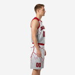 Front view of custom red and white basketball uniforms showing arched team name, front number, and red lightning pattern on white polyester jersey
