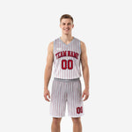 Custom red and white basketball uniforms with vertical red pinstripes, arced team name, and matching shorts shown front and back