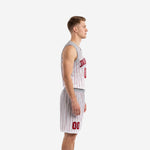 Front view of custom red and white basketball uniforms featuring V-neck jersey with pinstripe pattern and gray shoulder panels