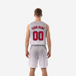 Opposite side view of the white and red pinstripe basketball uniform set with gray waistband and drawcord visible
