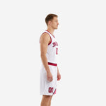 Side view of white and crimson custom basketball uniform showing curved red panel sweeping from armhole binding down the shorts leg