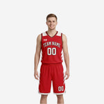 Red and white reversible basketball uniforms front view showing red side with white chevron side panels arced team name and number 00 on chest and shorts