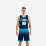 Red and white reversible basketball uniforms front view showing navy and cyan jersey with hexagon-fade shorts on male model