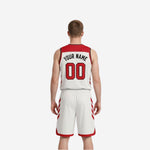 Red and white reversible basketball uniform opposite side view showing panel symmetry on both jersey and shorts
