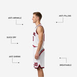 Close detail of matching basketball shorts with crimson swirl panel on lower left leg and black and white hem binding