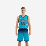 Left side view of red and white reversible basketball uniform showing V-neck jersey and gradient shorts construction
