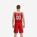 Red and white reversible basketball uniform side view showing chevron panel placement on jersey and shorts