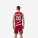 Side view of crimson red reversible basketball jersey showing armhole binding and diagonal swirl graphic wrapping the side panel
