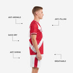 Custom red and white soccer kit with personalized team name, player number, and full-dye sublimated brush-stroke design