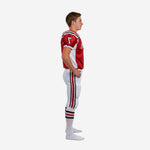 Custom red and white youth football uniforms showing front and back of sublimated jersey with matching white pants and red side stripe