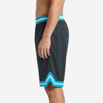 Red basketball shorts showing wing graphic wrapping the outer leg panel, opposite side view on adult male