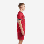 Red spiderweb soccer kit side view showing full sublimation on jersey and shorts, custom soccer uniforms