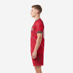 Custom sublimated red and black soccer uniform side profile, spiderweb pattern on jersey and shorts