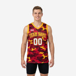 Custom red black and yellow basketball jersey with full-body camo sublimation, gold V-neck binding, and arced team name on front