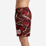 Left side detail of red camo basketball shorts showing elastic waistband and continuous crackle overlay print