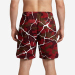 Right side detail of custom red camo crackle basketball shorts showing seam finish and hem length