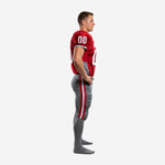 Side view of red and gray custom American football uniform showing gray side panel on the jersey and red double stripe outlined in white running down the outer pant leg